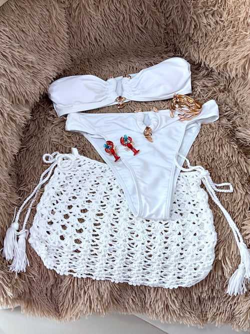 White bikini and incluido cover