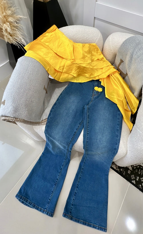 All inclusive, yellow blouse and earrings